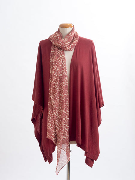 Odette Floral Silk Scarf  Sheer, soft and feminine, this floral silk has a beautiful fine pleat like creped texture, garnet rust flowers and leaves layered on a wash of cream and blush, with soft white highlights. An amazing accessory to pair with so many colours and a perfect way to add some warmth up near your face if you’re wearing a white T and jeans.  !00% Silk Yoryu pictured here with the garnet rust Muse Merino wrap.