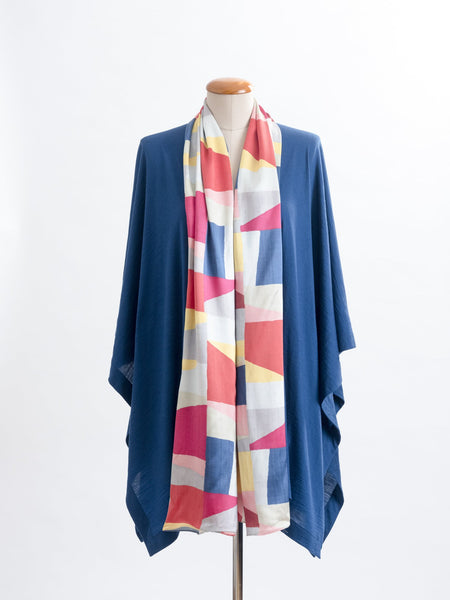 Mod Colour Block scarf, a geometric layering of muted bright hues, this scarf goes with almost anything! Soft blocks of blue, blush, cerise, garnet rust, sage, yellow, grey and pale blue melded together to take versatility to a whole new level. Self-lined in a tubular shape so it stays put hanging, or ties easily, never loosing shape and looking great no matter how you wear it.  100% silk satin Luxury, paired here with a teal muse wrap.