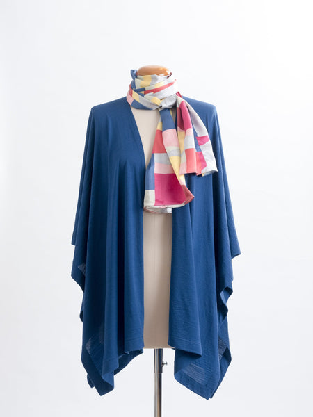 Mod Colour Block scarf, a geometric layering of muted bright hues, this scarf goes with almost anything! Soft blocks of blue, blush, cerise, garnet rust, sage, yellow, grey and pale blue melded together to take versatility to a whole new level. Self-lined in a tubular shape so it stays put hanging, or ties easily, never loosing shape and looking great no matter how you wear it.  100% silk satin Luxury, paired here with a teal muse wrap.