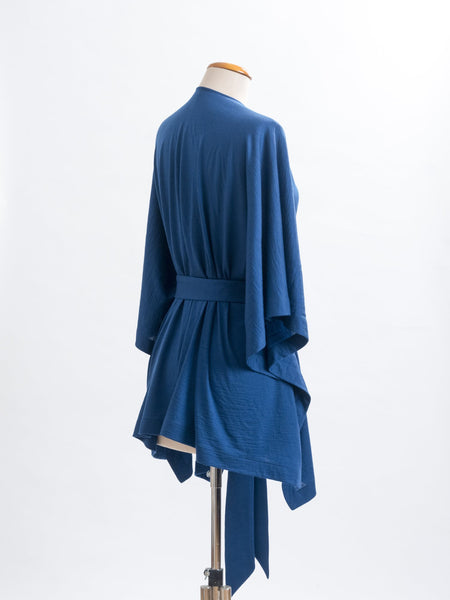 Teal Merino wool, the generous cut falls beautifully at the back , nipping in on the waistline.