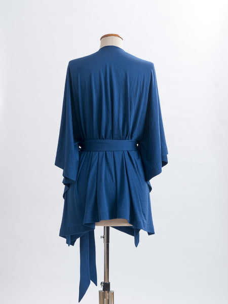 Teal Merino wool, the generous cut falls beautifully at the back , nipping in on the waistline.