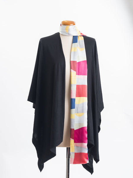 Mod Colour Block scarf, a geometric layering of muted bright hues, this scarf goes with almost anything! Soft blocks of blue, blush, cerise, garnet rust, sage, yellow, grey and pale blue melded together to take versatility to a whole new level. Self-lined in a tubular shape so it stays put hanging, or ties easily, never loosing shape and looking great no matter how you wear it.  100% silk satin Luxury, paired here with a black Muse wrap.