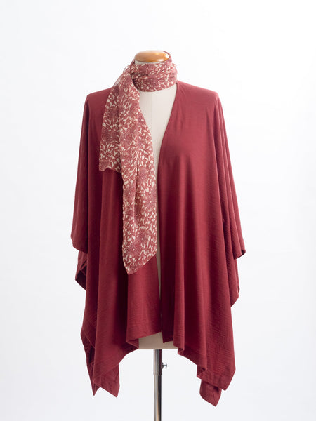 Odette Floral Silk Scarf  Sheer, soft and feminine, this floral silk has a beautiful fine pleat like creped texture, garnet rust flowers and leaves layered on a wash of cream and blush, with soft white highlights. An amazing accessory to pair with so many colours and a perfect way to add some warmth up near your face if you’re wearing a white T and jeans.  !00% Silk Yoryu pictured here with the garnet rust Muse Merino wrap.