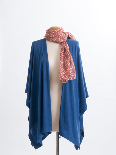 Odette Floral Silk Scarf  Sheer, soft and feminine, this floral silk has a beautiful fine pleat like creped texture, garnet rust flowers and leaves layered on a wash of cream and blush, with soft white highlights. An amazing accessory to pair with so many colours and a perfect way to add some warmth up near your face if you’re wearing a white T and jeans.  !00% Silk Yoryu pictured here with the teal Muse Merino wrap.